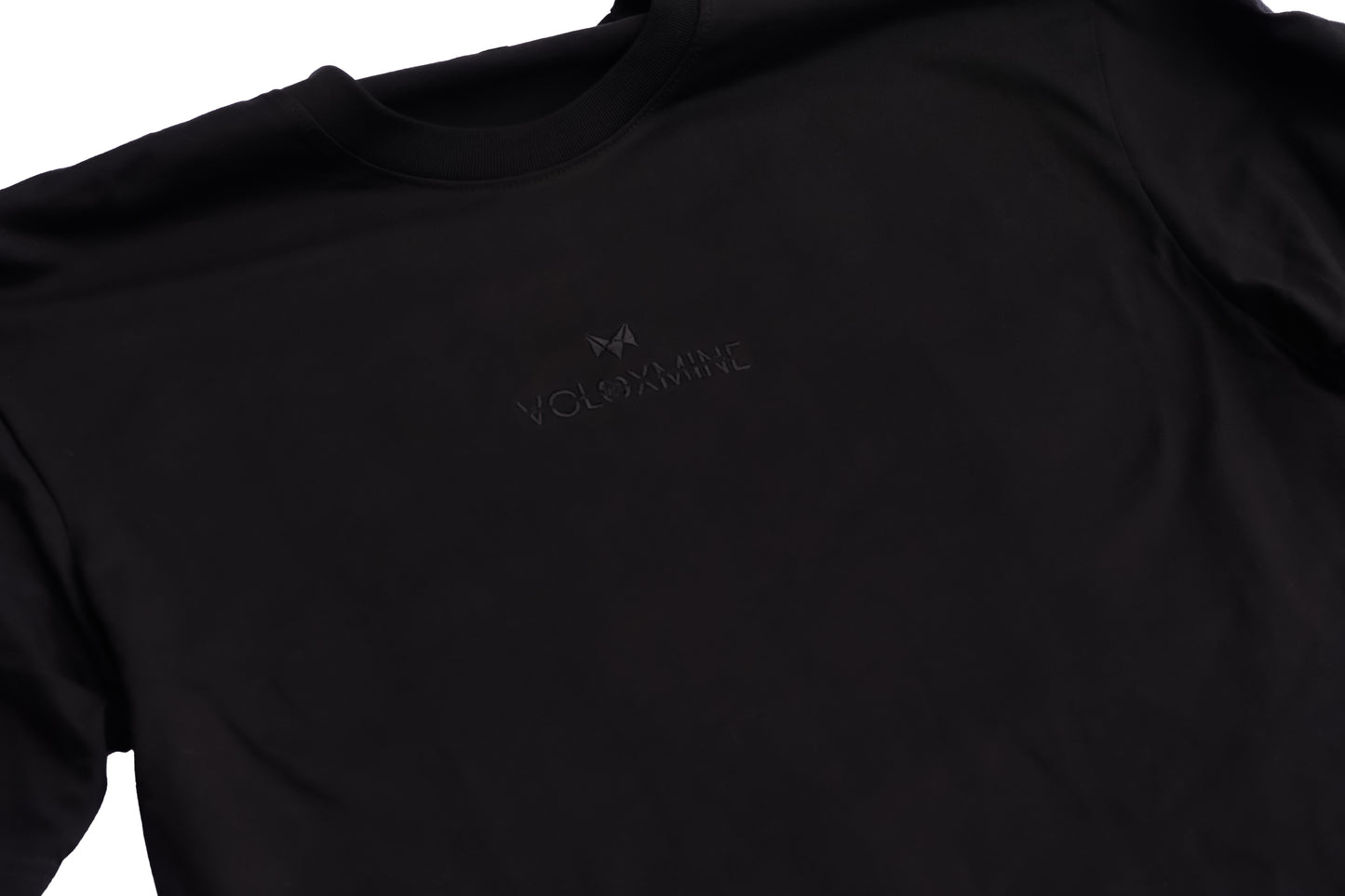 A black T-shirt with a logo on the front, displayed against a white background
