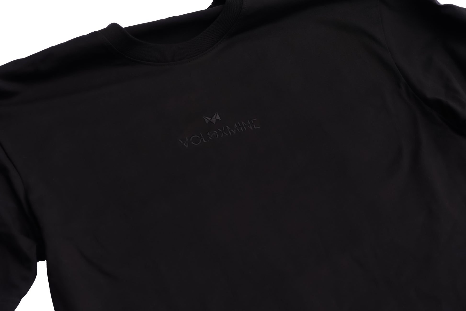 A black T-shirt with a logo on the front, displayed against a white background