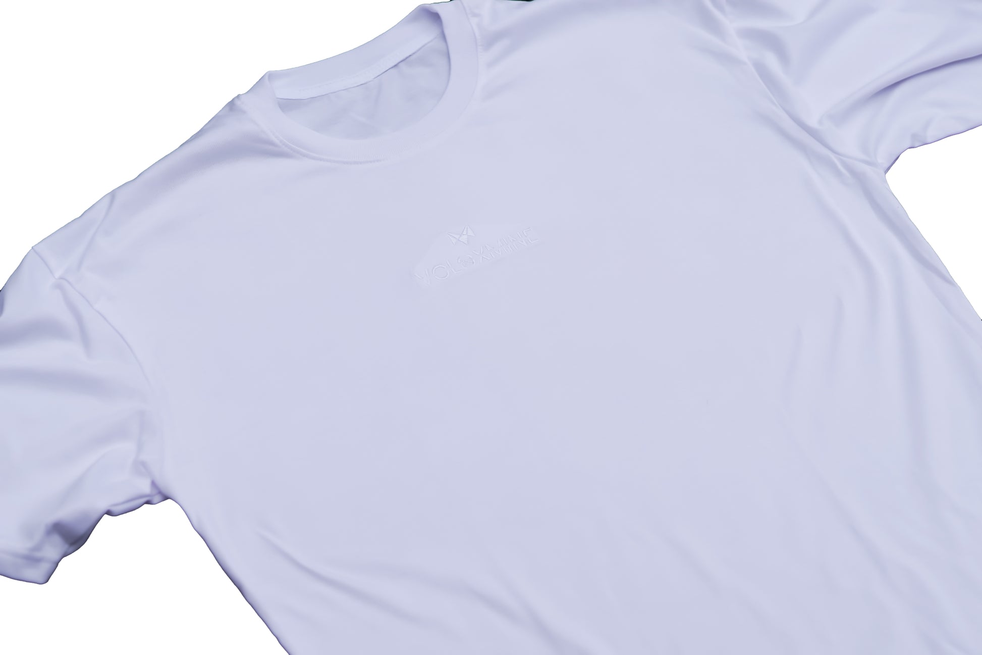 A white oversized T-shirt with a small logo on the front, displayed against a white background